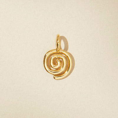 Spiral charm in gold